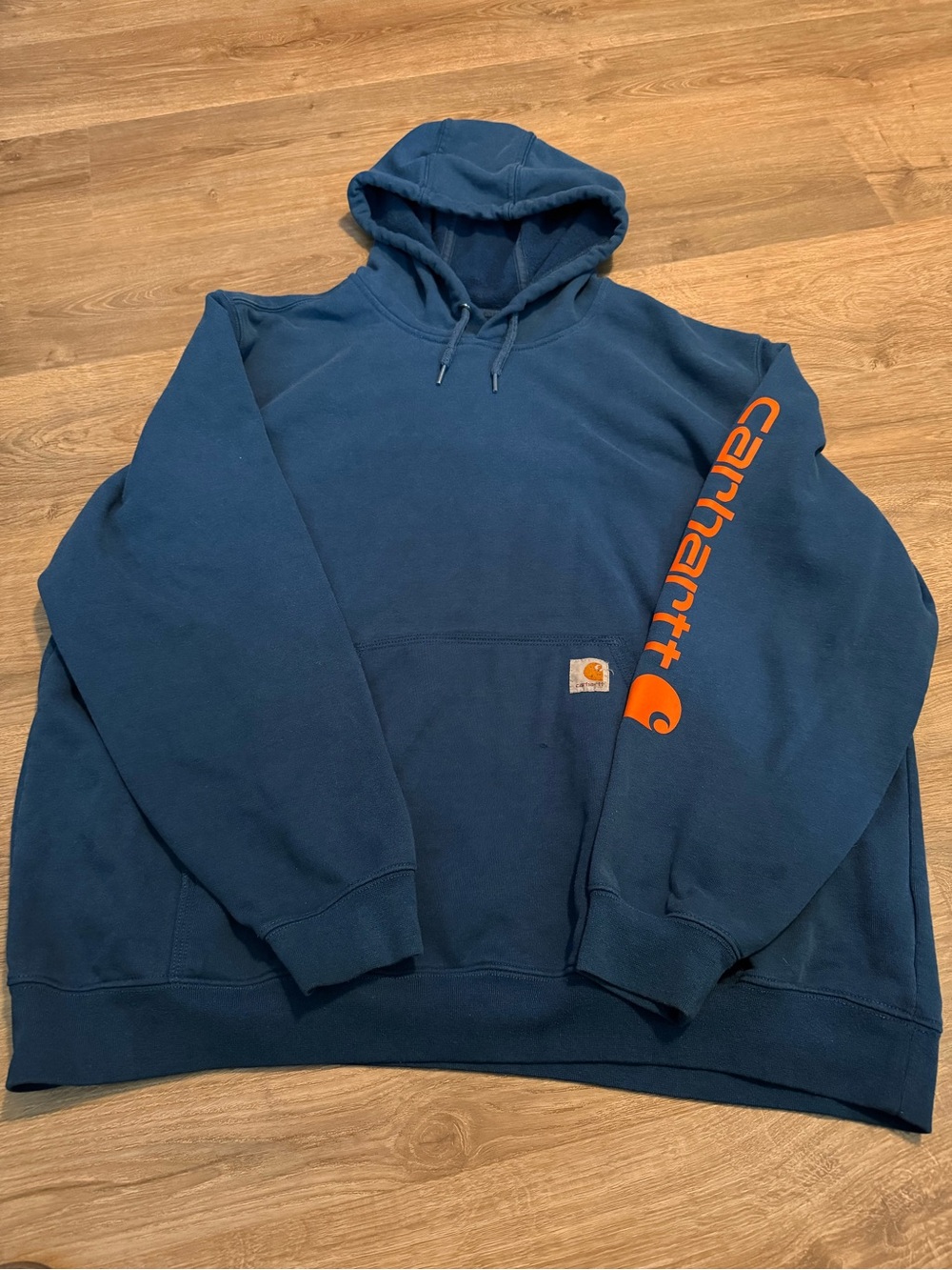 Carhartt Navy Pullover Hoodie with Orange Sleeve Logo